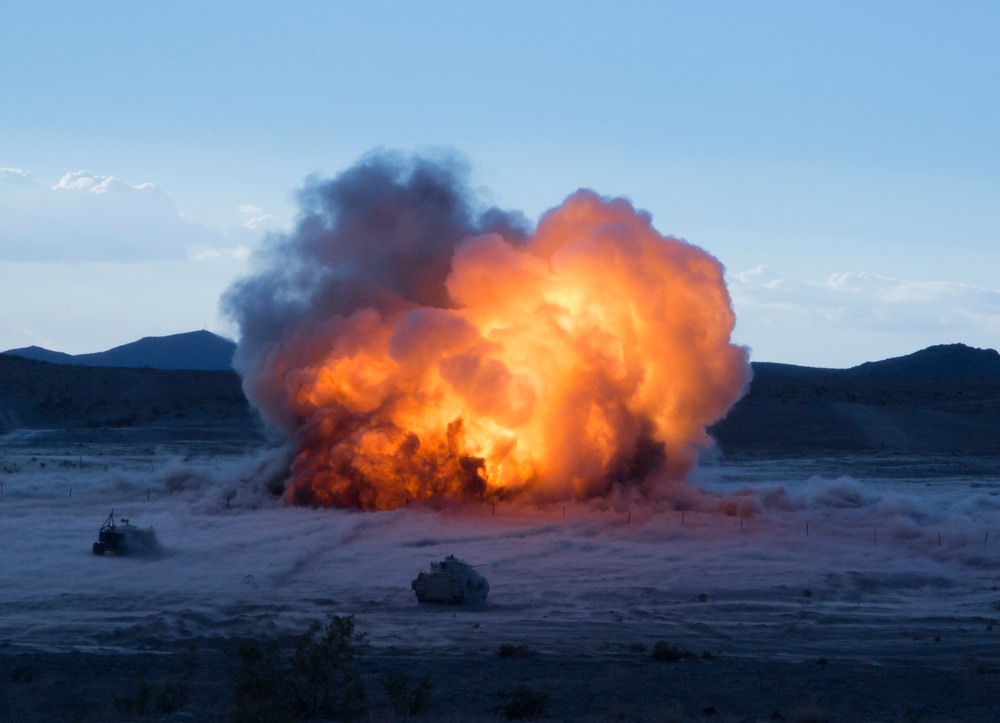 Soldiers fire an M58 Mine Clearing Line Charge rocket to breach an enemy gate