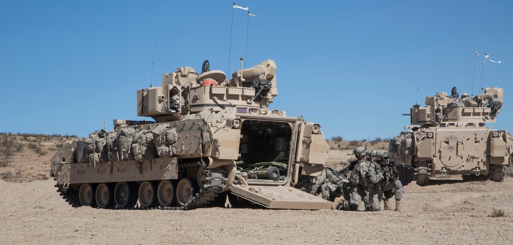 Soldiers breach and attack enemy compound