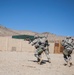 Soldiers breach and attack enemy compound