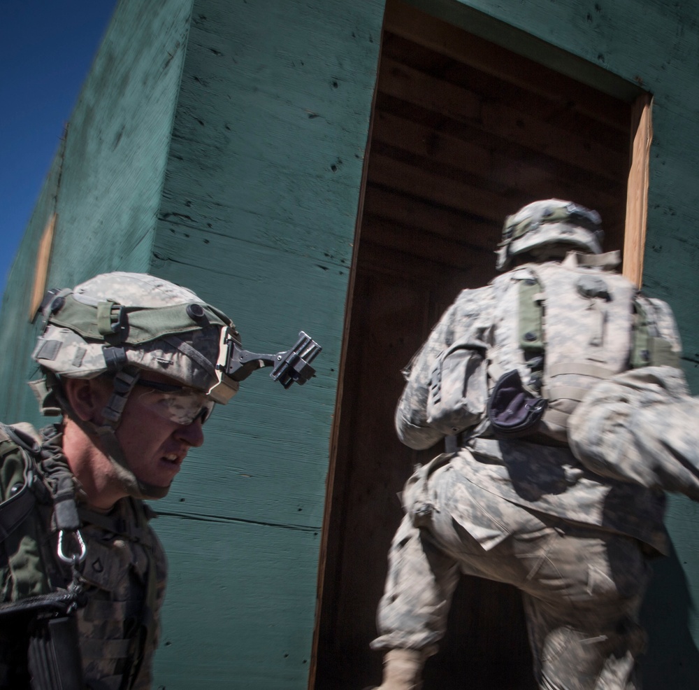 Soldiers breach and attack enemy compound