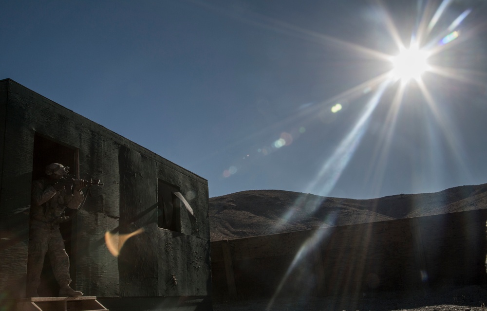 Soldiers breach and attack enemy compound