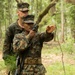 Parris Island recruits guide themselves through wooded areas using a map, compass