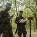 Parris Island recruits guide themselves through wooded areas using a map, compass