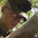 Parris Island recruits guide themselves through wooded areas using a map, compass