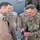 Brig. Gen. Donnie Walker Jr., commanding general of the 3d Sustainment Command (Expeditionary) recognizes Capt. Nick Burke, flight commander with 17th Airlift Squadron