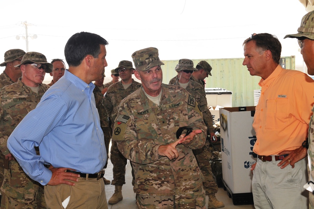Brig. Gen. Donnie Walker Jr. discusses retro-sort operations with Nevada Gov. Brian Sandoval and Tennessee Gov. Bill Haslam