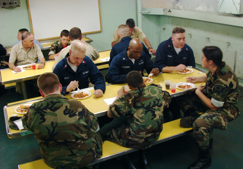 Sailors and Sea Cadets share dinner