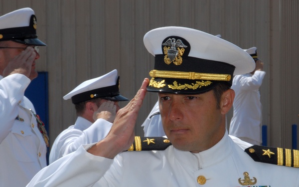 Cmdr. Joseph DiGuardo salutes during the change of command ceremony