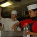 USS George H.W. Bush culinary specialists prepare Christmas meal