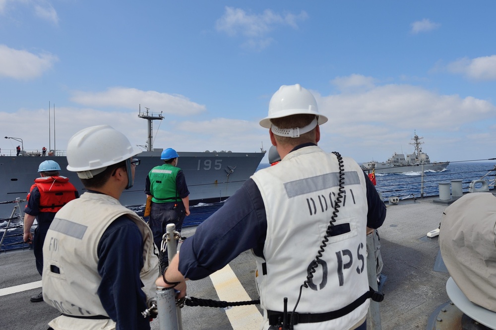 USS Ross Sailors observe underway replenishment