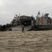 Sailors load Landing Craft Air Cushion 86 with equipment