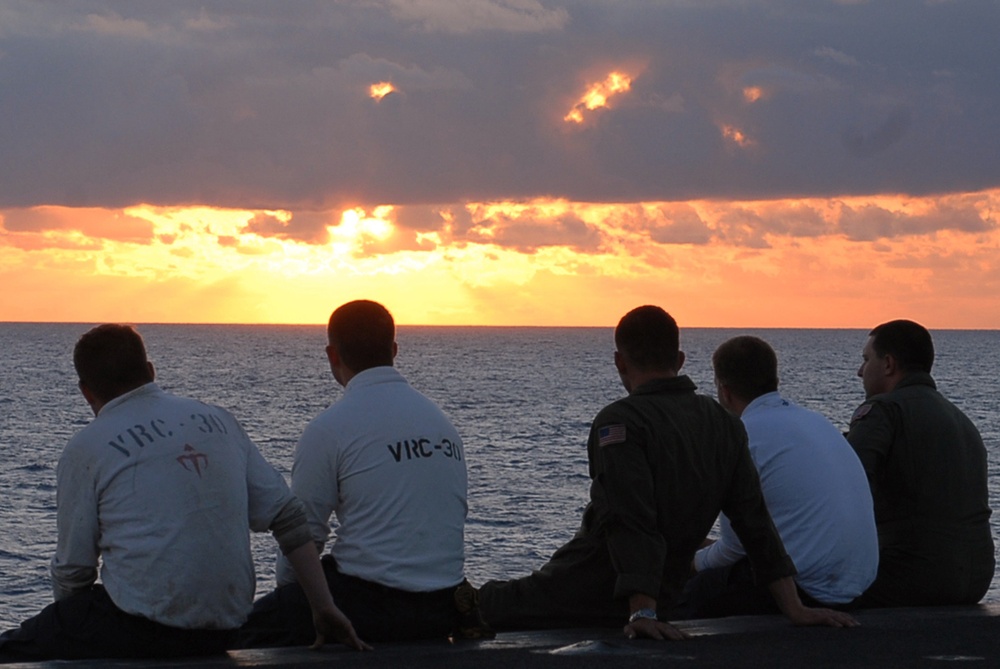 Sailors watch sunset