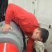 USS Harry S. Truman Sailor cleans a cargo and weapons elevator machinery room