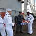 USS Nimit sailors fold ensign