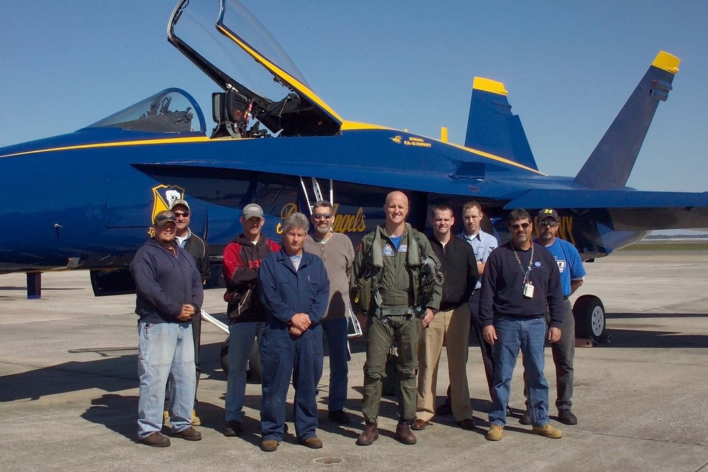 Lt. Cmdr. Nate Marler takes photo with Fleet Readiness Center Southeast flight test crew