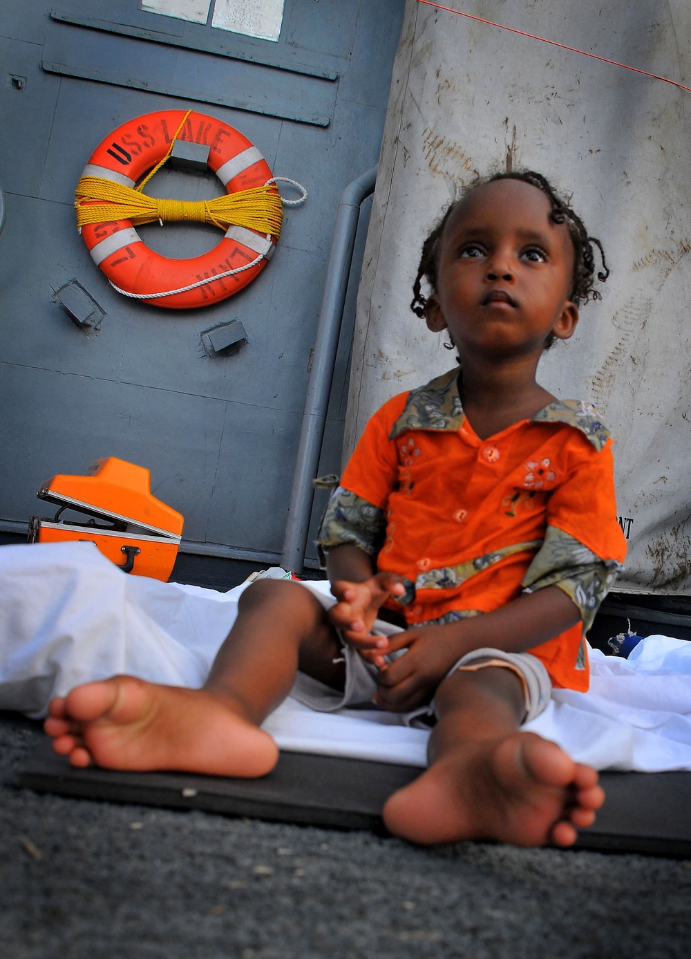 Somali child aboard USS Lake Champlain after rescue