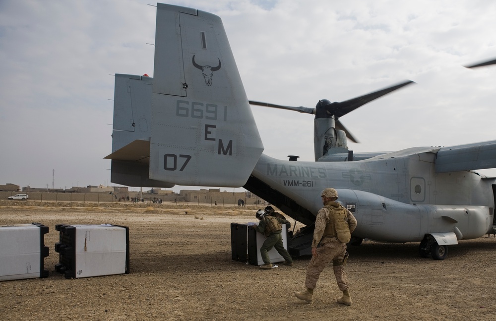 Marines unload supplies at Camp Leatherneck