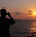Marine takes photos of sunset aboard USS Bataan