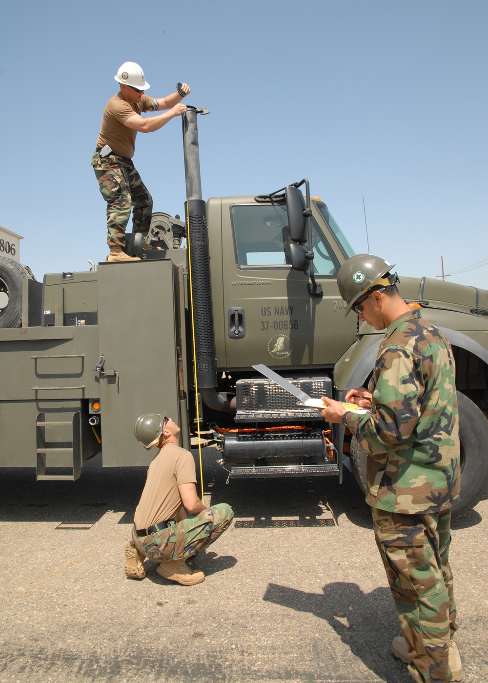 NMCB-4 Seabees prepare water well support vehicle for shipment