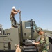 NMCB-4 Seabees prepare water well support vehicle for shipment
