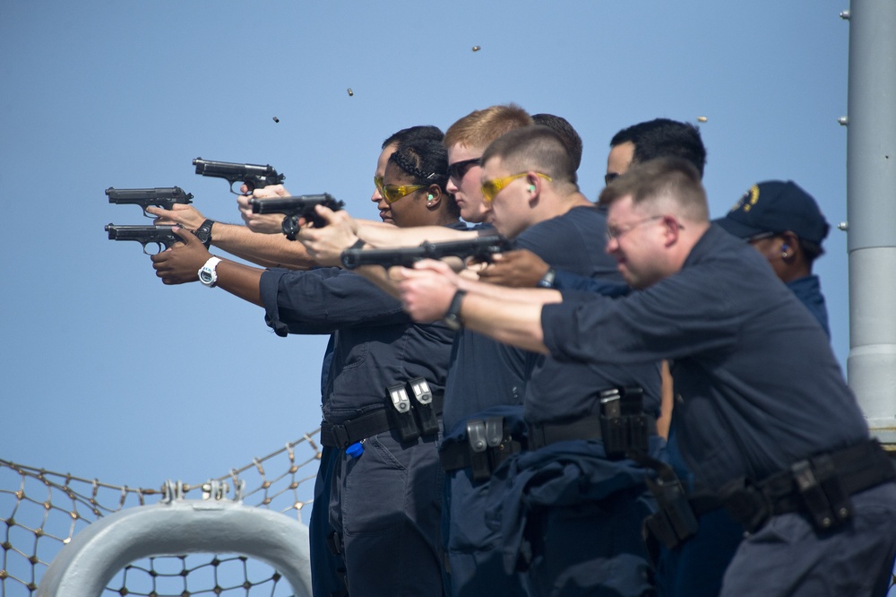 Sailors conduct weapons qualification course aboard USS Arleigh Burke