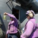 USS Mesa Verde Sailor takes fuel sample