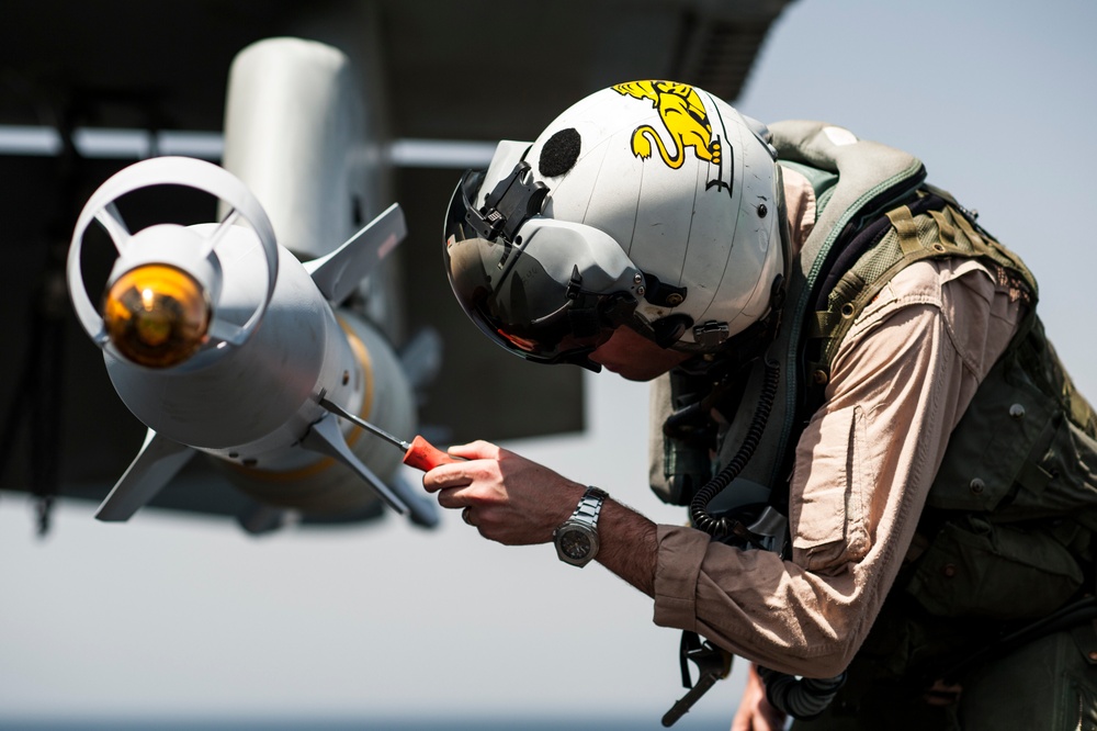 F/A-18C Hornet pre-flight checks aboard USS George H.W. Bush