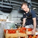 USS George H.W. Bush sailor moves crates