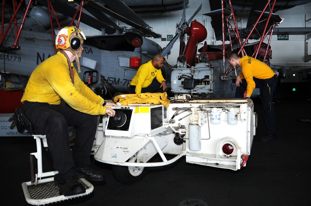 Sailors prep to move helicopter