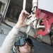 USS George H.W. Bush sailor inspects aircraft