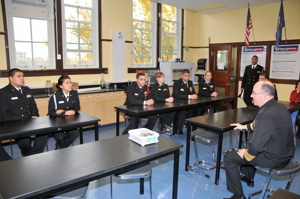 Commander of United States Fleet Forces Command talks with students