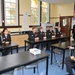 Commander of United States Fleet Forces Command talks with students