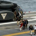 Former President George H.W. Bush arrives aboard the aircraft carrier USS George H.W. Bush