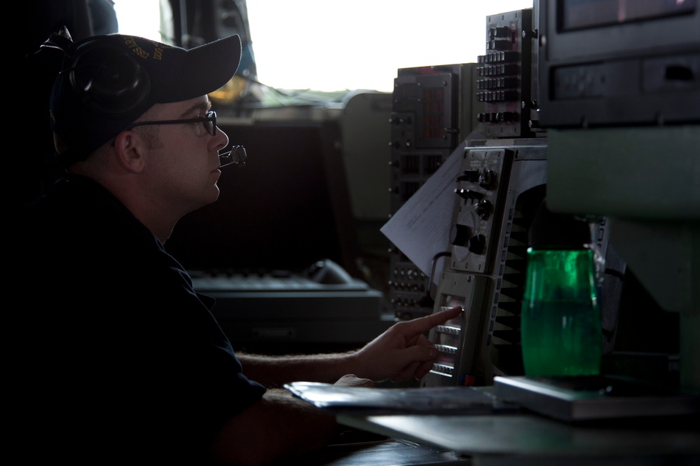 USS Arleigh Burke Sailor monitors ship traffic