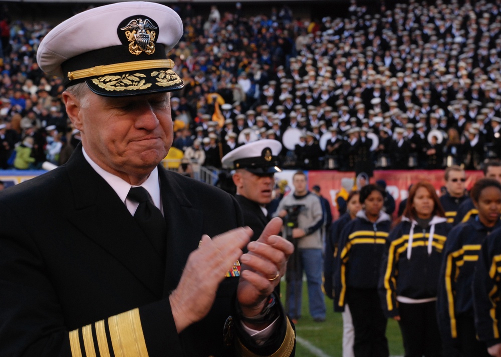 Chief of Naval Operations applauds after administering the oath of enlistment