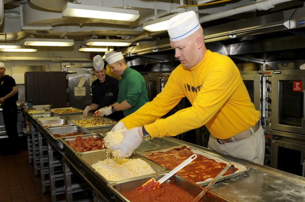 USS George H.W. Bush Sailor prepares pizzas