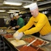 USS George H.W. Bush Sailor prepares pizzas