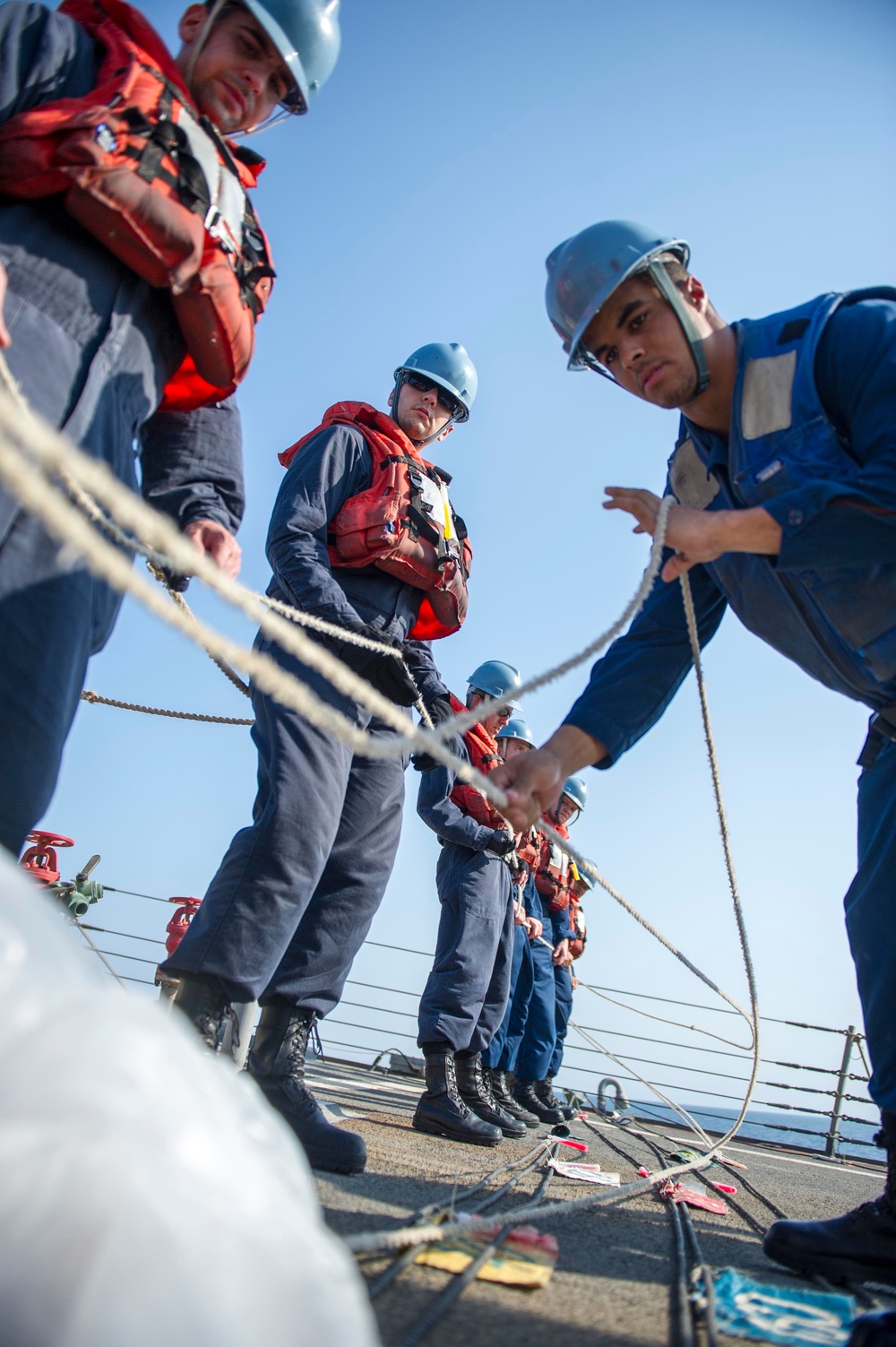 USS Roosevelt sailors heave a line