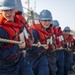 USS Roosevelt sailors heave a line