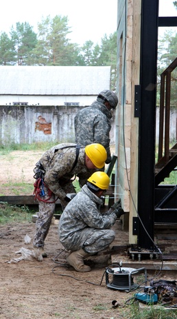 Latvian and US engineers construct a rappel tower