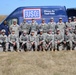 Competitors pose for a photo during Best Warrior event