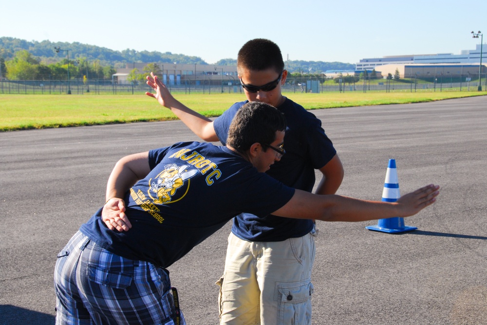 Two cadets with the Osbourn Park High School (Manassas, Va.) NJROTC enjoy a moment of fun
