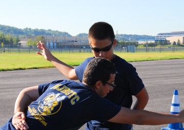 Two cadets with the Osbourn Park High School (Manassas, Va.) NJROTC enjoy a moment of fun