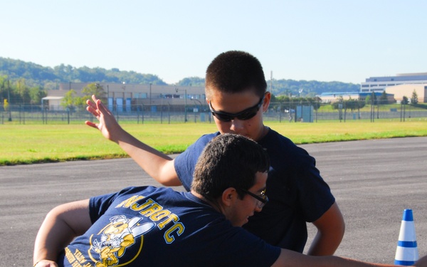 Two cadets with the Osbourn Park High School (Manassas, Va.) NJROTC enjoy a moment of fun