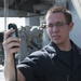 USS George H.W. Bush Sailor takes weather reading