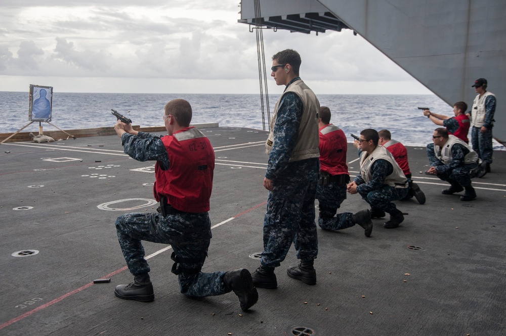 USS George Washington Sailors conduct 9 mm pistol live-fire