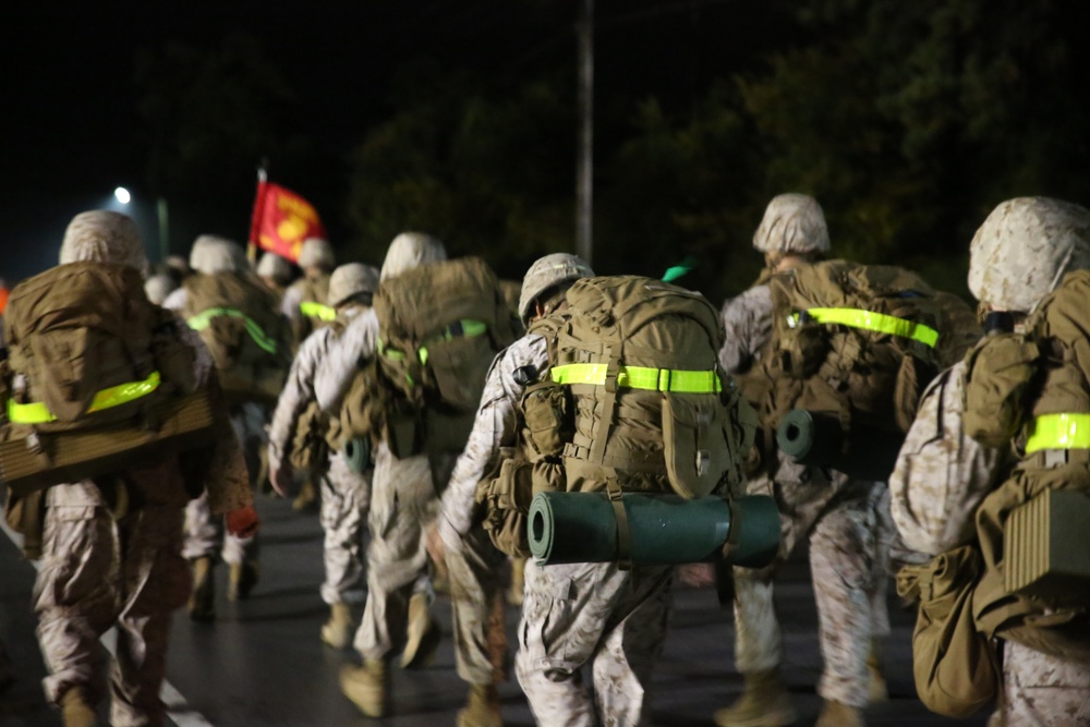 Integrated Task Force artillery Marines step off for hike