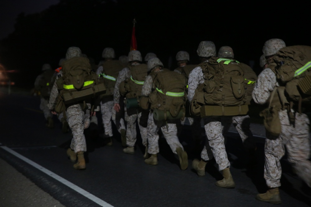 Integrated Task Force artillery Marines step off for hike