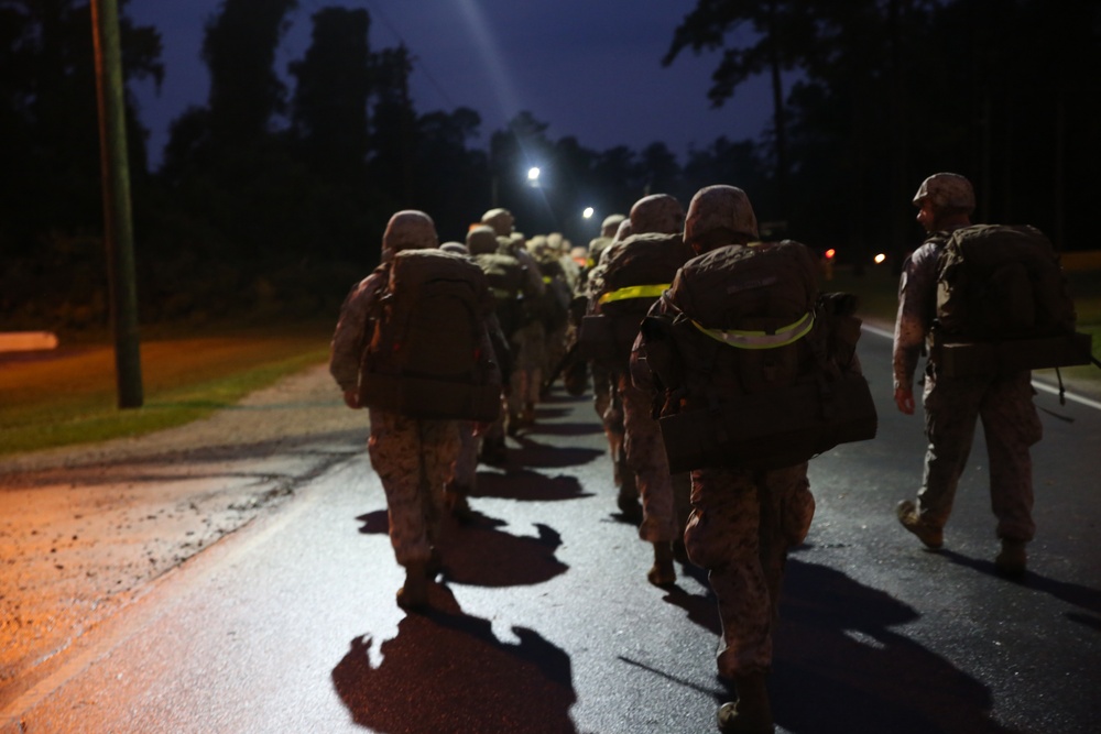 Integrated Task Force artillery Marines step off for hike