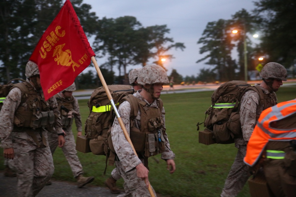 Integrated Task Force artillery Marines step off for hike